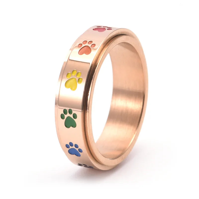 Rotativ Antistressring i Guld och Silver med Färgade Tassmönster – Thea